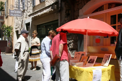 Visitors passing the shop