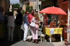 Visitors passing the shop